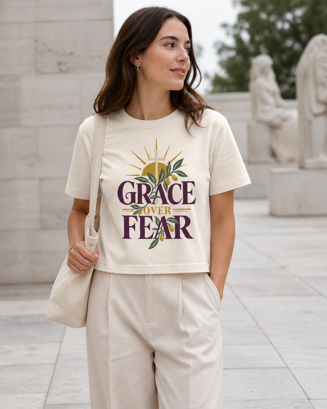 Woman wearing the Grace Over Fear cropped tee