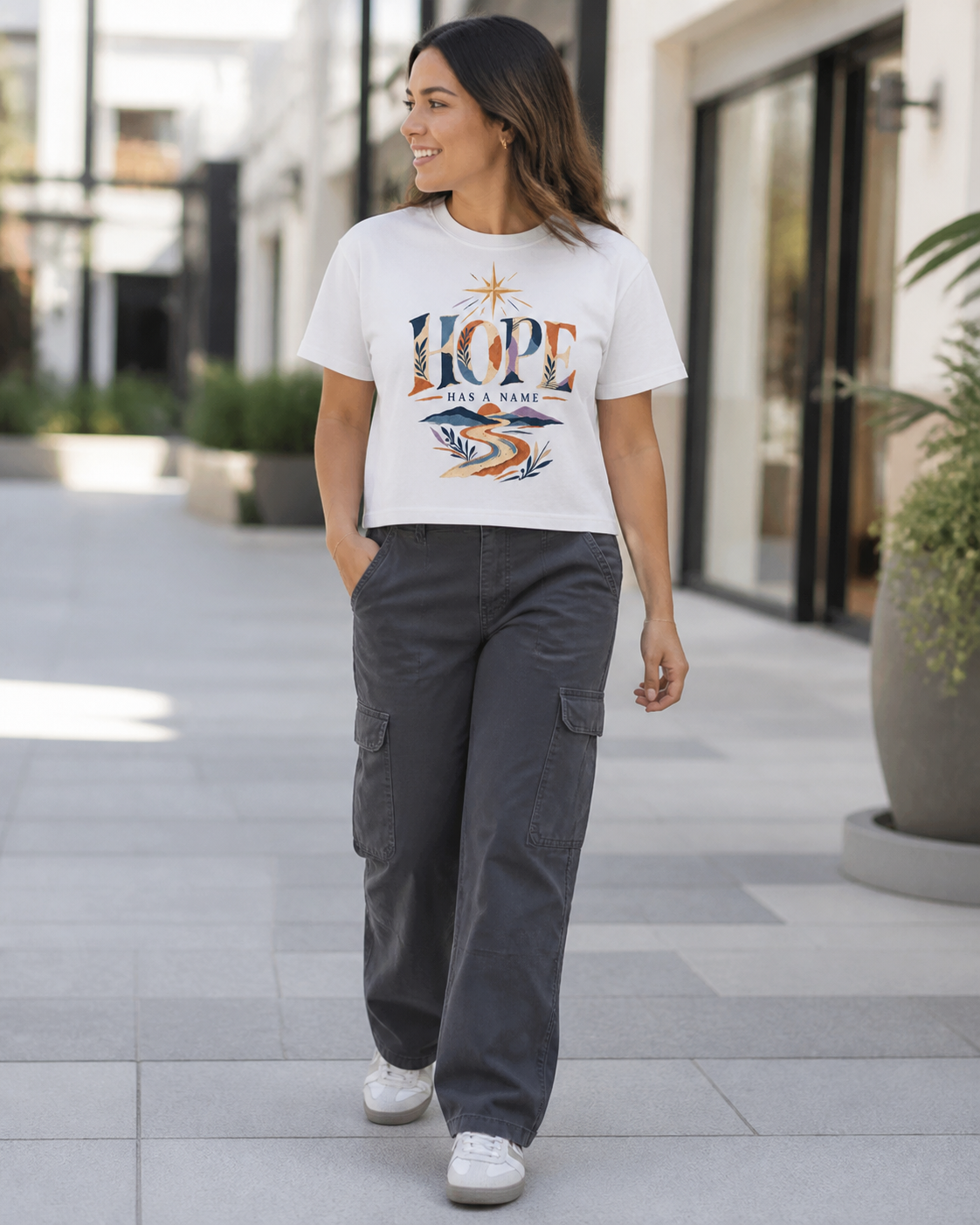 Woman wearing the Hope Has A Name cropped tee