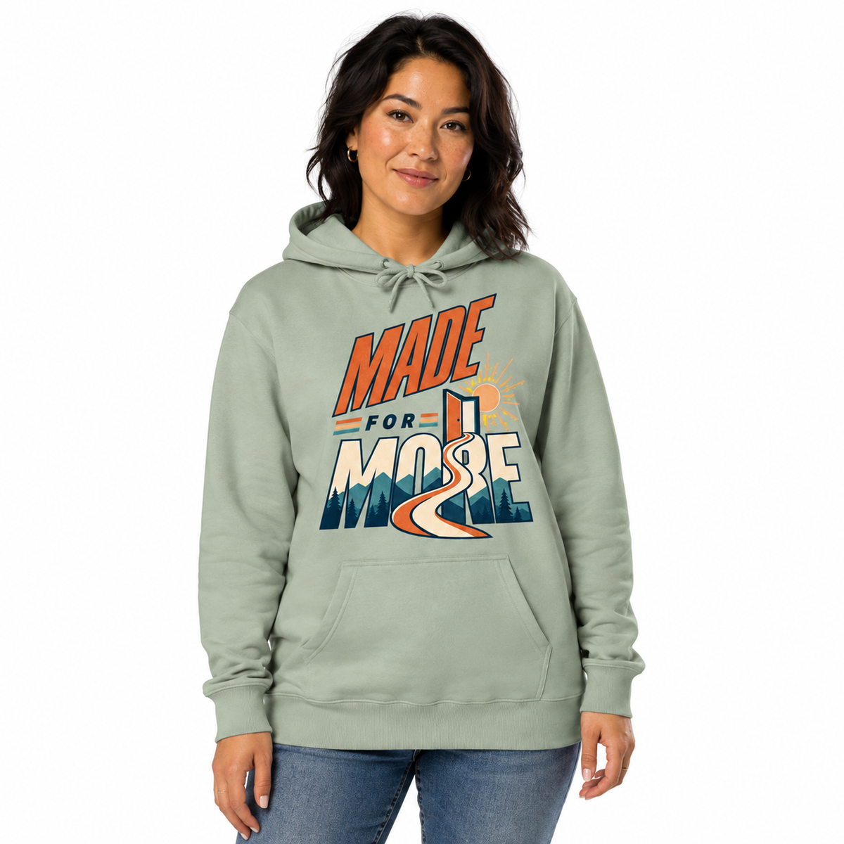 Woman wearing the Made For More sage hoodie on a white studio background