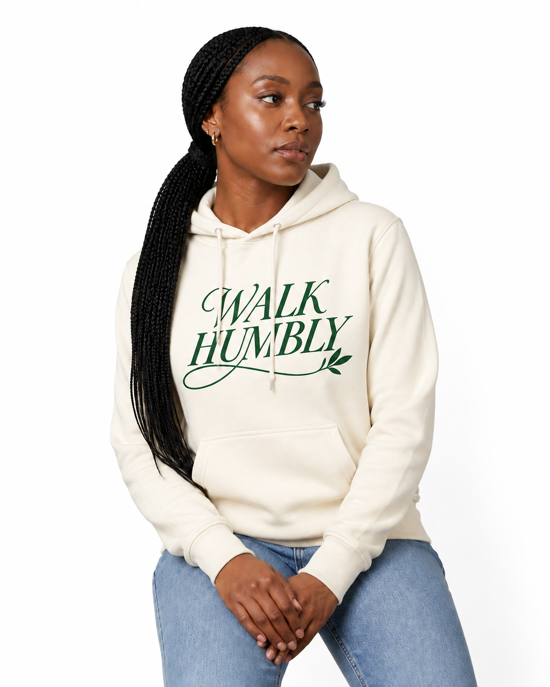 Woman wearing the Walk Humbly hoodie on a white studio background