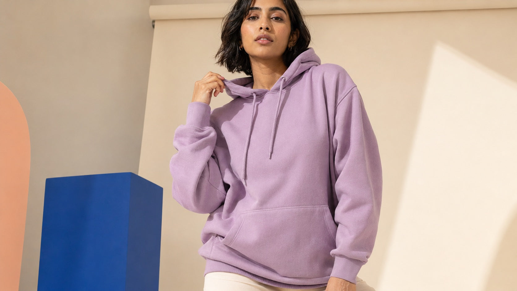 Woman wearing a lavender blank fleece hoodie