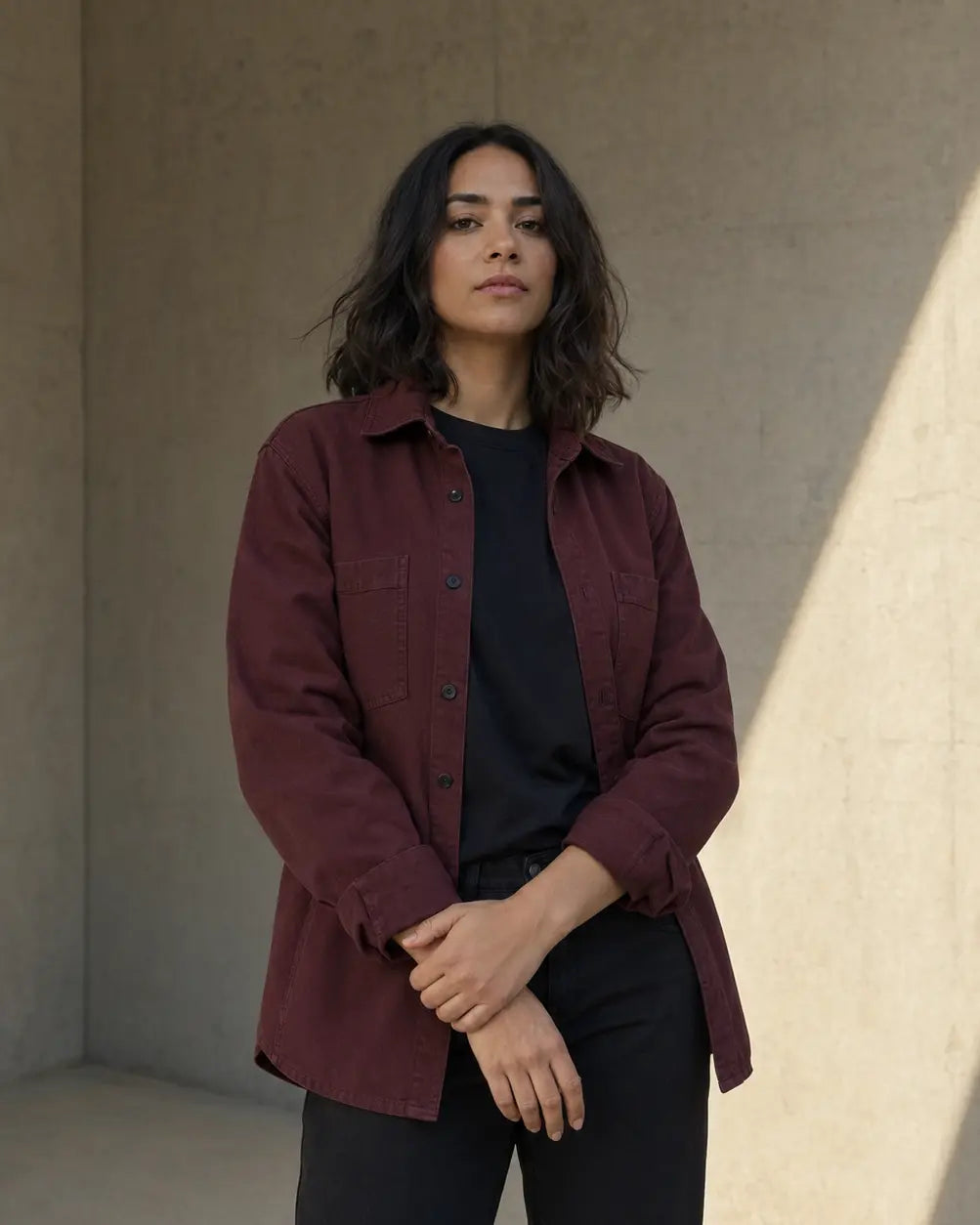Woman wearing a burgundy workwear overshirt