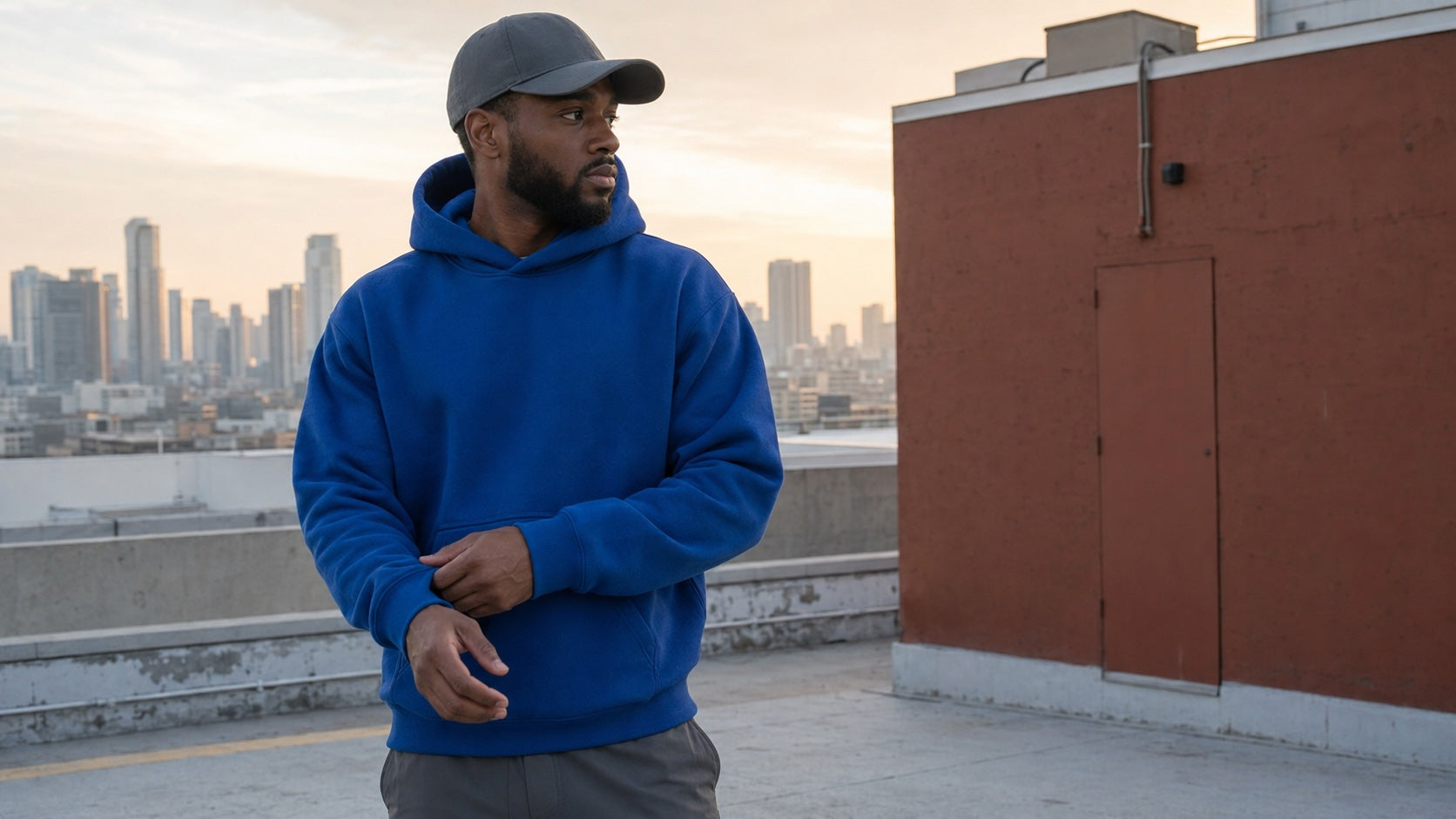 Man wearing a cobalt blank hoodie and cap